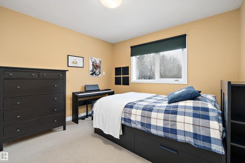 Bedroom featuring light colored carpet and baseboards - 10623 75 Avenue, Edmonton, AB - Indoor Photo Showing Bedroom