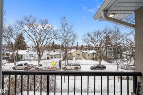 Snow covered back of property featuring a residential view - 10623 75 Avenue, Edmonton, AB - Outdoor