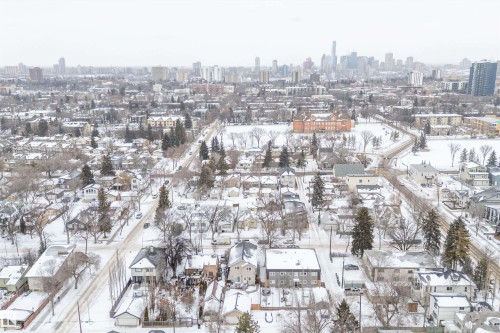 Snowy aerial view featuring a view of skyline - 10623 75 Avenue, Edmonton, AB - Outdoor With View