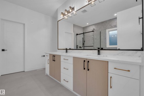 Bathroom featuring double vanity and a marble finish shower - 108 Eldridge Point(E), St. Albert, AB - Indoor