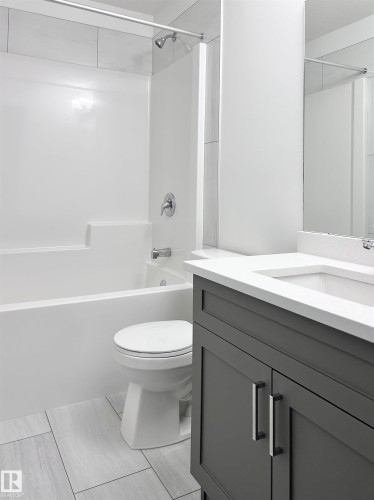 Full bath with vanity and bathtub / shower combination - 19704 29 Avenue, Edmonton, AB - Indoor Photo Showing Bathroom