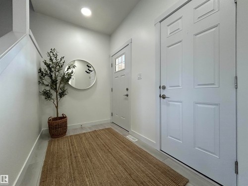 Foyer with baseboards and recessed lighting - 19704 29 Avenue, Edmonton, AB - Indoor Photo Showing Other Room