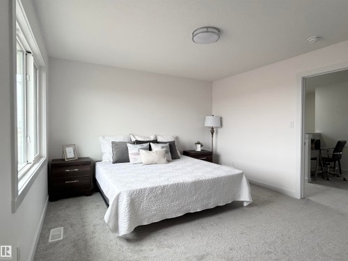 Carpeted bedroom with baseboards - 19704 29 Avenue, Edmonton, AB - Indoor Photo Showing Bedroom