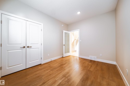 Unfurnished bedroom with light wood finished floors and a closet - 2237 56 Street, Edmonton, AB - Indoor Photo Showing Other Room