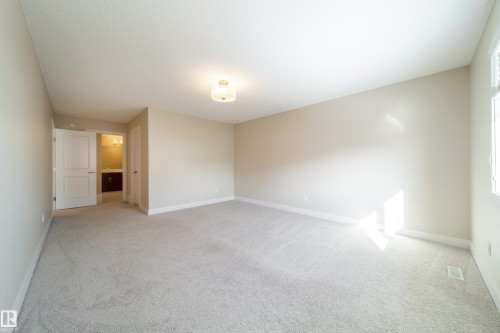 Unfurnished room with light carpet and baseboards - 2237 56 Street, Edmonton, AB - Indoor Photo Showing Other Room