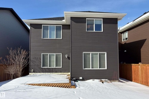 View of snow covered rear of property - 2237 56 Street, Edmonton, AB - Outdoor With Exterior