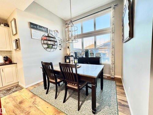 Dining room with light wood-style flooring - 425 Sheppard Boulevard, Leduc, AB - Indoor Photo Showing Dining Room