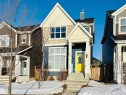 View of front of property featuring board and batten siding and a chimney - 425 Sheppard Boulevard, Leduc, AB  - Outdoor With Facade 
