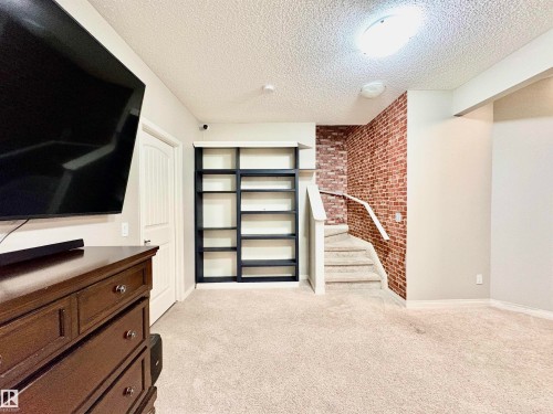 Interior space featuring light carpet - 425 Sheppard Boulevard, Leduc, AB - Indoor Photo Showing Other Room