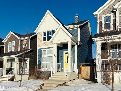View of front facade featuring a chimney and board and batten siding - 425 Sheppard Boulevard, Leduc, AB - Outdoor With Facade