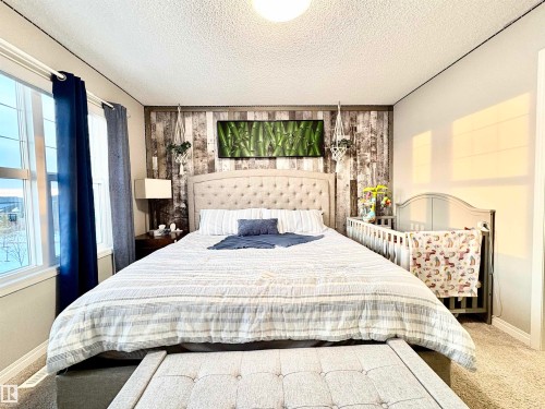 Bedroom with carpet and a textured ceiling - 425 Sheppard Boulevard, Leduc, AB - Indoor Photo Showing Bedroom