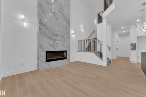 3606 40 Avenue, Beaumont, AB - Indoor Photo Showing Living Room With Fireplace