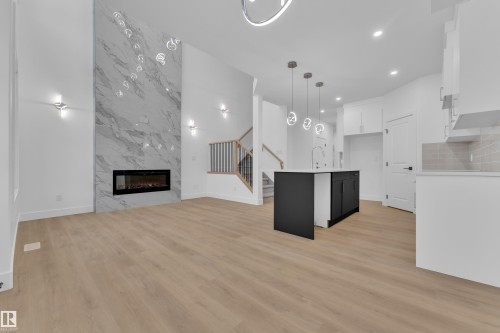 3606 40 Avenue, Beaumont, AB - Indoor Photo Showing Other Room With Fireplace