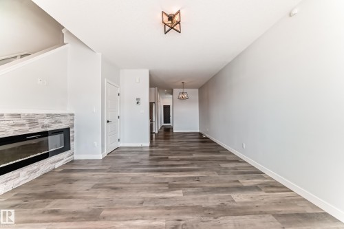 22 Meadowview Way, Leduc, AB - Indoor Photo Showing Other Room With Fireplace