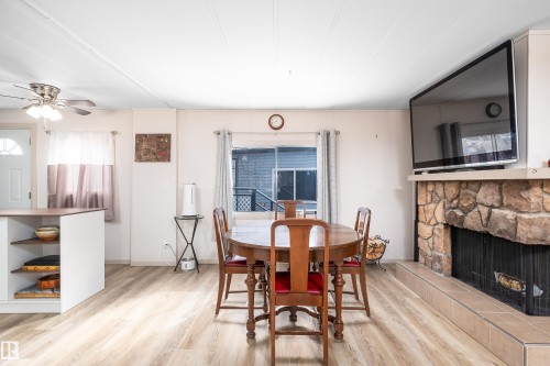 1706 West Oak Close, Edmonton, AB - Indoor Photo Showing Dining Room With Fireplace