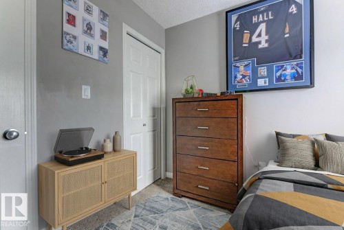 Bedroom with light colored carpet and a textured ceiling - #127 2905 141 Street, Edmonton, AB - Indoor Photo Showing Other Room