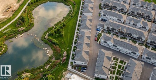 Aerial view of property and surrounding area featuring a large body of water - #127 2905 141 Street, Edmonton, AB - Outdoor With Body Of Water With View