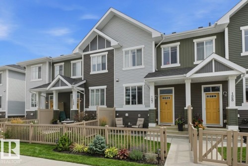 Craftsman-style house with covered porch and a fenced front yard - #127 2905 141 Street, Edmonton, AB - Outdoor With Facade