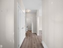Corridor with light wood-style floors and baseboards - 8921 217 St Nw, Edmonton, AB  - Indoor Photo Showing Other Room 