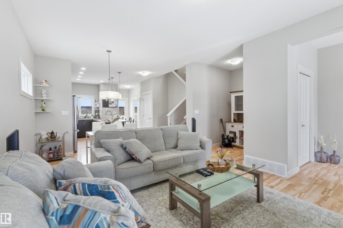 Living area with light wood-type flooring and recessed lighting - 149 Hawks Ridge Boulevard, Edmonton, AB - Indoor Photo Showing Living Room