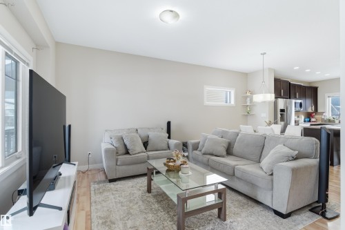 Living room with recessed lighting and light wood-style floors - 149 Hawks Ridge Boulevard, Edmonton, AB - Indoor Photo Showing Living Room