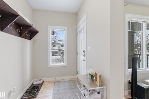 Mudroom featuring baseboards and light wood finished floors - 149 Hawks Ridge Boulevard, Edmonton, AB - Indoor Photo Showing Other Room
