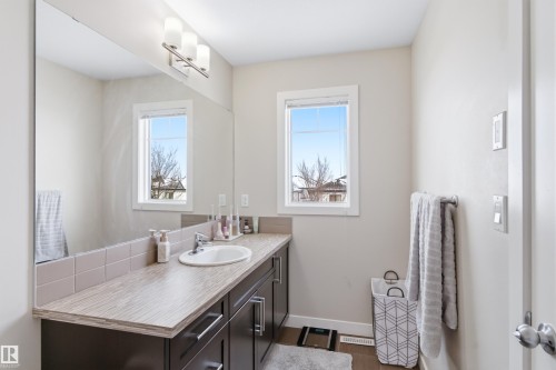 Bathroom featuring vanity and healthy amount of natural light - 149 Hawks Ridge Boulevard, Edmonton, AB - Indoor Photo Showing Bathroom
