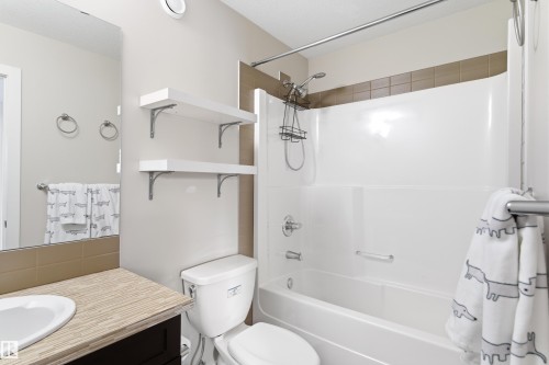 Bathroom featuring vanity and shower / tub combo - 149 Hawks Ridge Boulevard, Edmonton, AB - Indoor Photo Showing Bathroom
