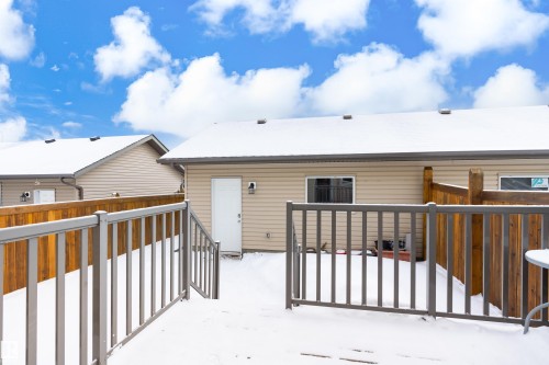 Snow covered property with a deck - 149 Hawks Ridge Boulevard, Edmonton, AB - Outdoor With Exterior