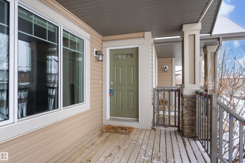 Doorway to property featuring a porch - 149 Hawks Ridge Boulevard, Edmonton, AB - Outdoor With Deck Patio Veranda With Exterior