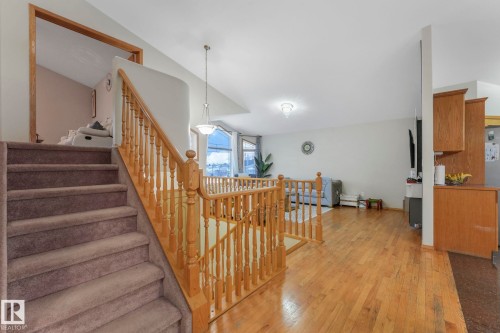 Staircase with hardwood / wood-style flooring - 4720 150 Avenue, Edmonton, AB - Indoor Photo Showing Other Room