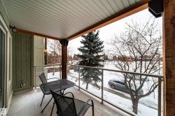 View of snow covered back of property - 