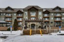 Snow covered building with a view of apartment building / complex - 237 278 Suder Greens Drive, Edmonton, AB  - Outdoor With Facade 