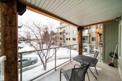View of snow covered back of property - 