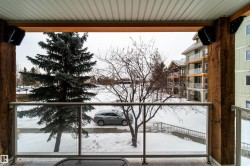View of snow covered back of property - 