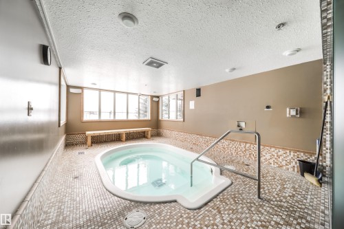 View of pool featuring a hot tub and a sunroom - 237 278 Suder Greens Drive, Edmonton, AB - Indoor Photo Showing Other Room