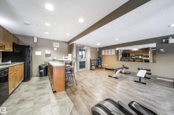 Workout room with a textured ceiling and recessed lighting - 