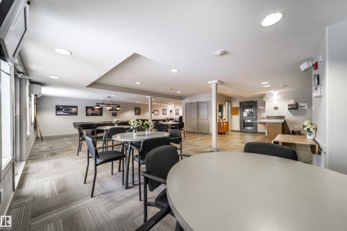 Dining area with recessed lighting and a textured ceiling - 237 278 Suder Greens Drive, Edmonton, AB - Indoor Photo Showing Dining Room