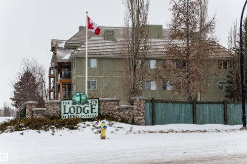Snow covered building featuring a view of apartment building / complex - 237 278 Suder Greens Drive, Edmonton, AB - Outdoor