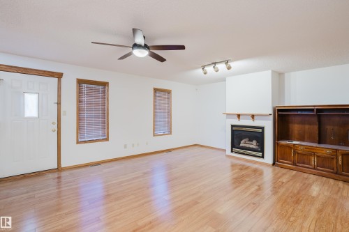 535 Pardee Bay Bay, Edmonton, AB - Indoor Photo Showing Other Room With Fireplace