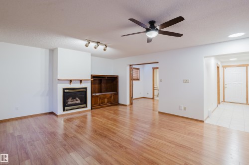 535 Pardee Bay Bay, Edmonton, AB - Indoor Photo Showing Living Room With Fireplace