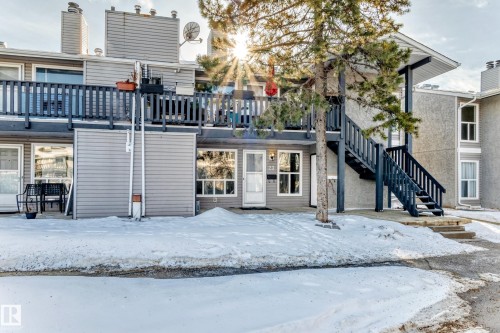 Snow covered building featuring stairs - 23 1503 Mill Woods Road E, Edmonton, AB - Outdoor