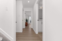 Hallway featuring recessed lighting and light wood-style flooring. You have entered onto the bedroom level. - 