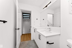 Secondary bath featuring vanity, tub, shower, and wc. - 