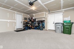 Double oversized garage with storage and mechanical room. - 