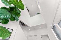 Foyer entrance featuring a towering ceiling and stairway. How beautiful is this! - 
