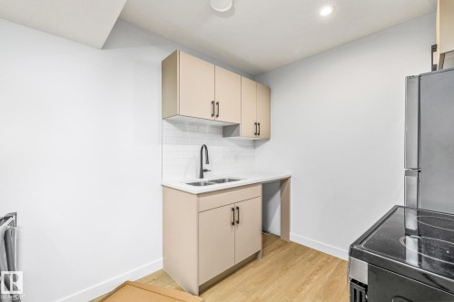110 Honeysuckle Green, Leduc, AB - Indoor Photo Showing Kitchen With Double Sink
