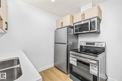 110 Honeysuckle Green, Leduc, AB - Indoor Photo Showing Kitchen With Double Sink