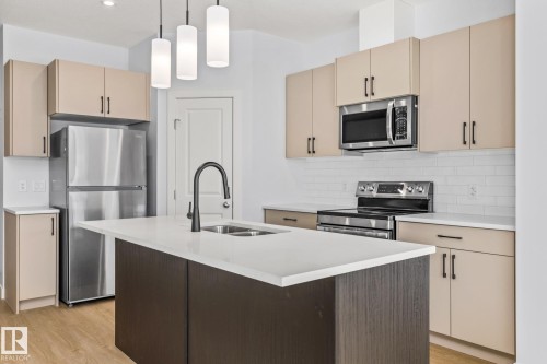 110 Honeysuckle Green, Leduc, AB - Indoor Photo Showing Kitchen With Double Sink With Upgraded Kitchen