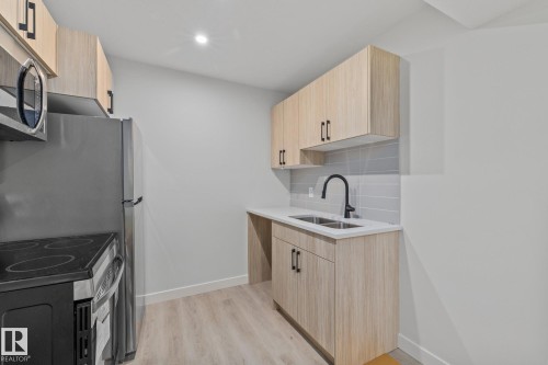 112 Honeysuckle Green, Leduc, AB - Indoor Photo Showing Kitchen With Double Sink